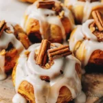 Charming Pumpkin Shaped Cinnamon Rolls with Cream Cheese Frosting